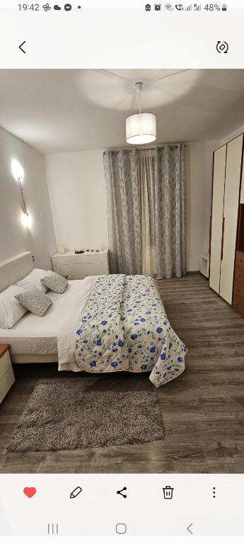 a bedroom with a bed with a blanket on it at La dimora di Gabi in Venice