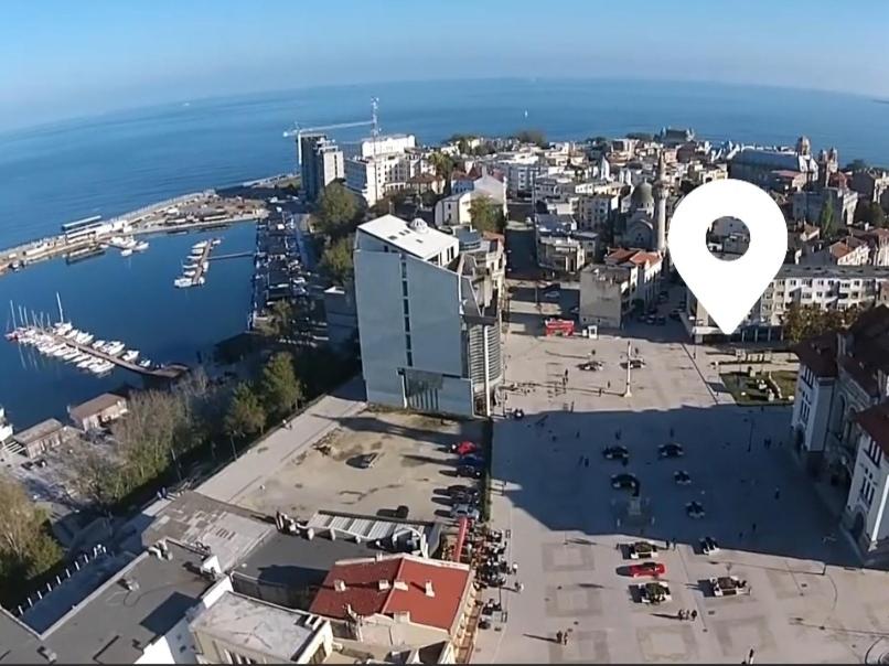 an aerial view of a city with a white dot at Ovidiu's dream in Constanţa