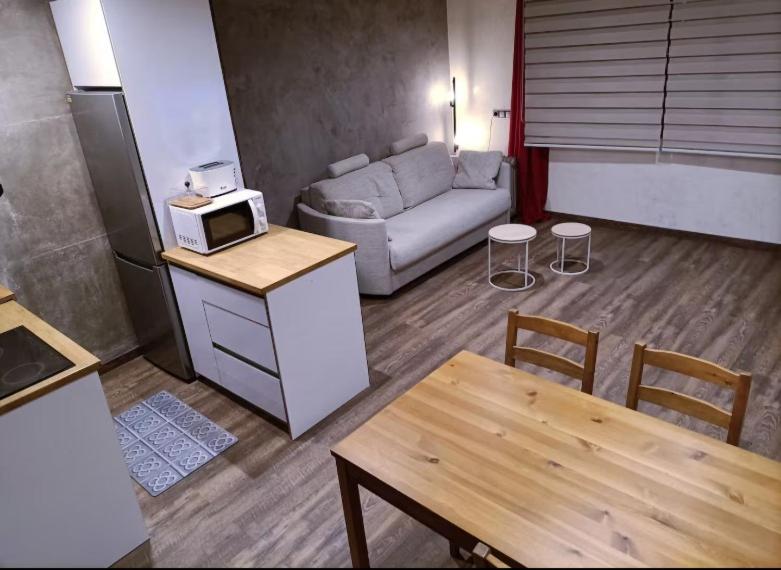 a living room with a couch and a table at Paniquera in Andorra la Vella