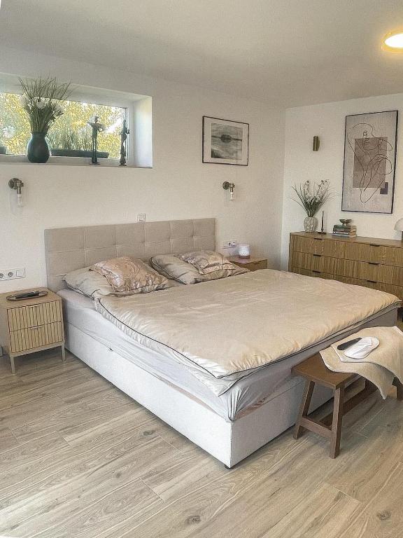 a bedroom with a large bed in a room at U zlatého křížku in Loukov