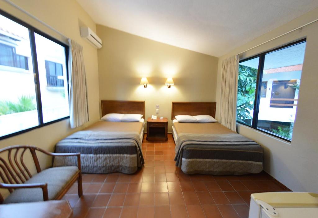 Cama ou camas em um quarto em SINA SUITES CANCUN - Adults Only