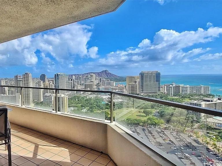 a balcony with a view of the city and the ocean at Best View in Honolulu in Honolulu
