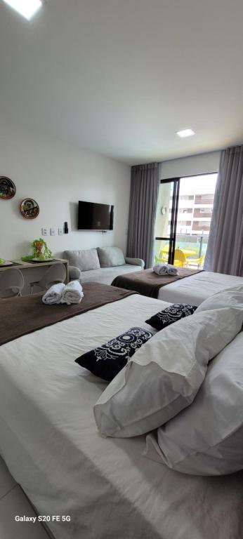 Ένα ή περισσότερα κρεβάτια σε δωμάτιο στο Refúgio By Paty - Malia Beach Studio Porto de Galinhas Muro Alto - Família