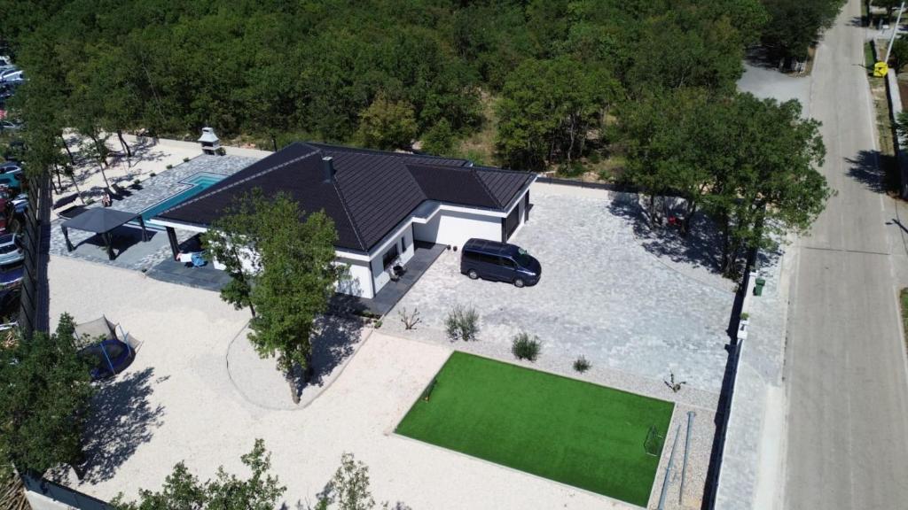 an aerial view of a house with a car in the yard at Villa Vanja in Imotski
