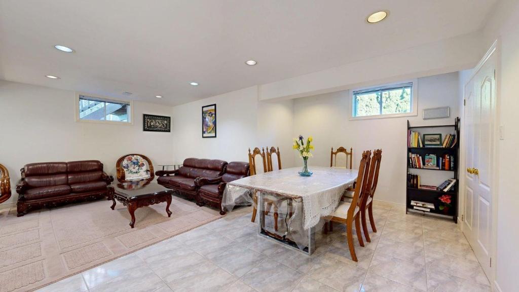 a living room with a table and a couch at Home Away From Home in Richmond Hill