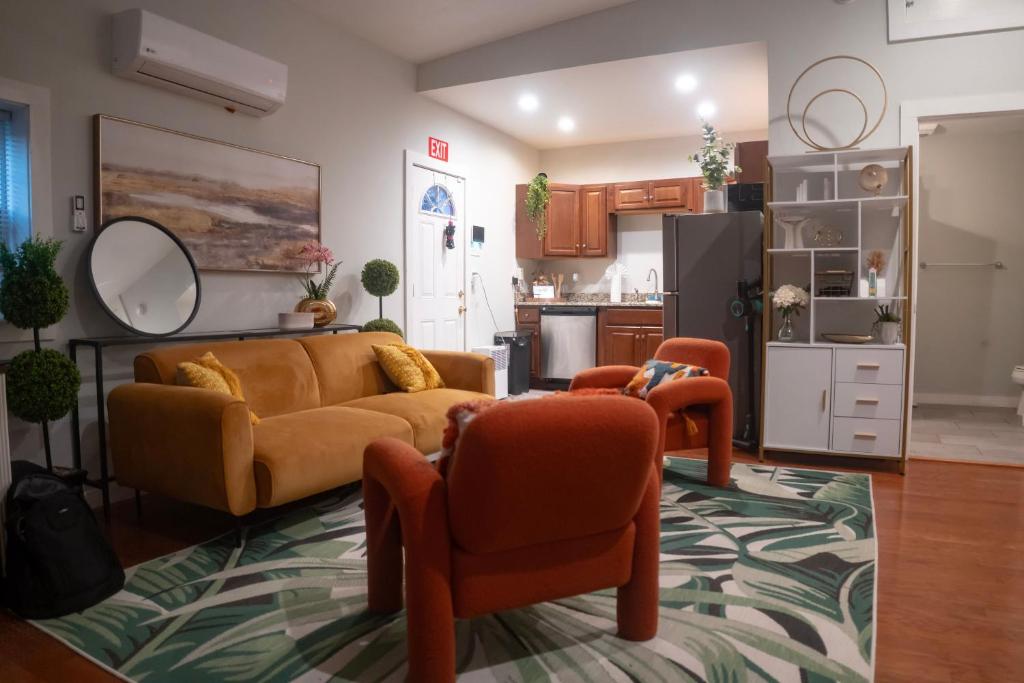 a living room with a couch and two chairs at Centrally-Located Studio in DWTN Richmond in Richmond