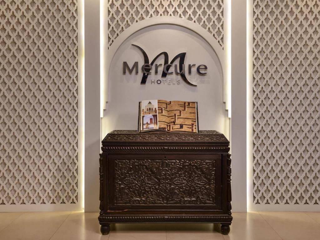 a table in front of a store with a sign at Mercure Shéhérazade Rabat in Rabat