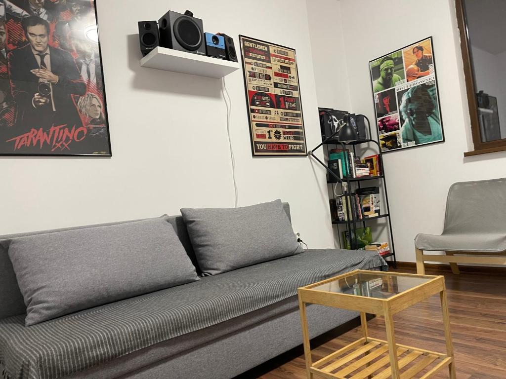 a living room with a couch and a table at Cinema house at Sofia center in Sofia