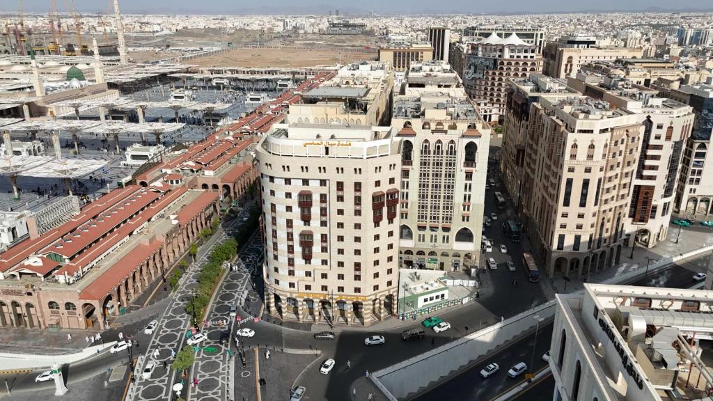 an aerial view of a city with tall buildings at فندق سبال الماسي الإشراق سابقا -sebal almasi hotel in Al Madinah