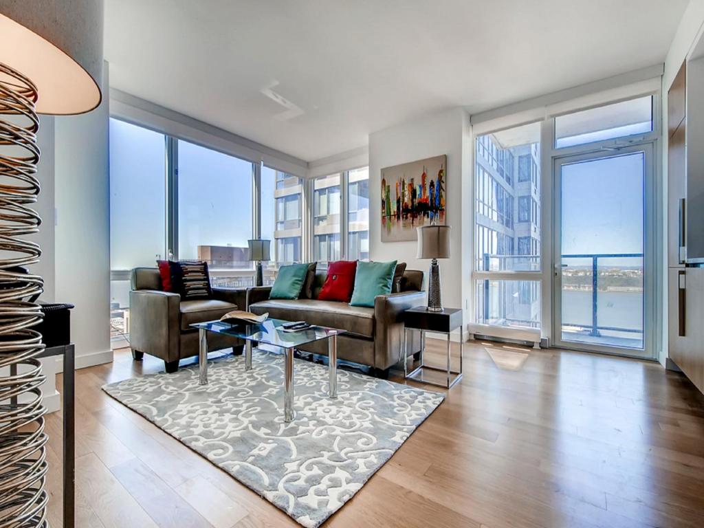 a living room with a couch and a table at Global Luxury Suites at Sky in New York