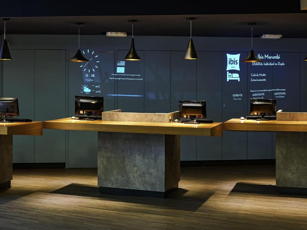 a row of counters in a room with lights at ibis Sao Paulo Morumbi in Sao Paulo