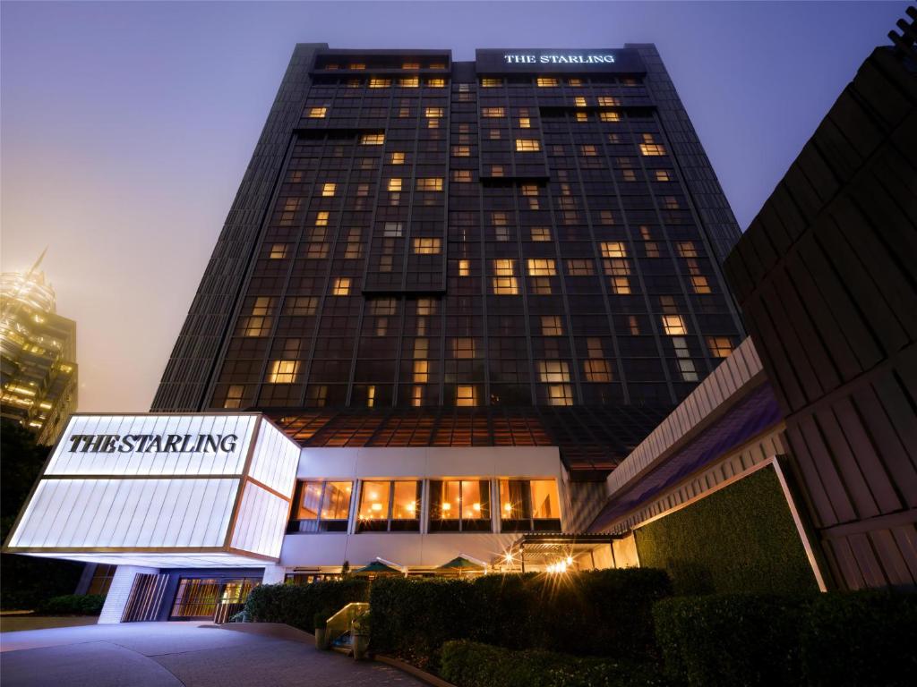 a tall building with a sign in front of it at The Starling Atlanta Midtown, Curio Collection by Hilton in Atlanta