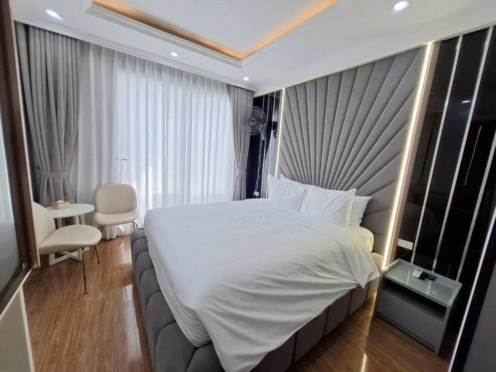 Postel nebo postele na pokoji v ubytování Lavie Hotel