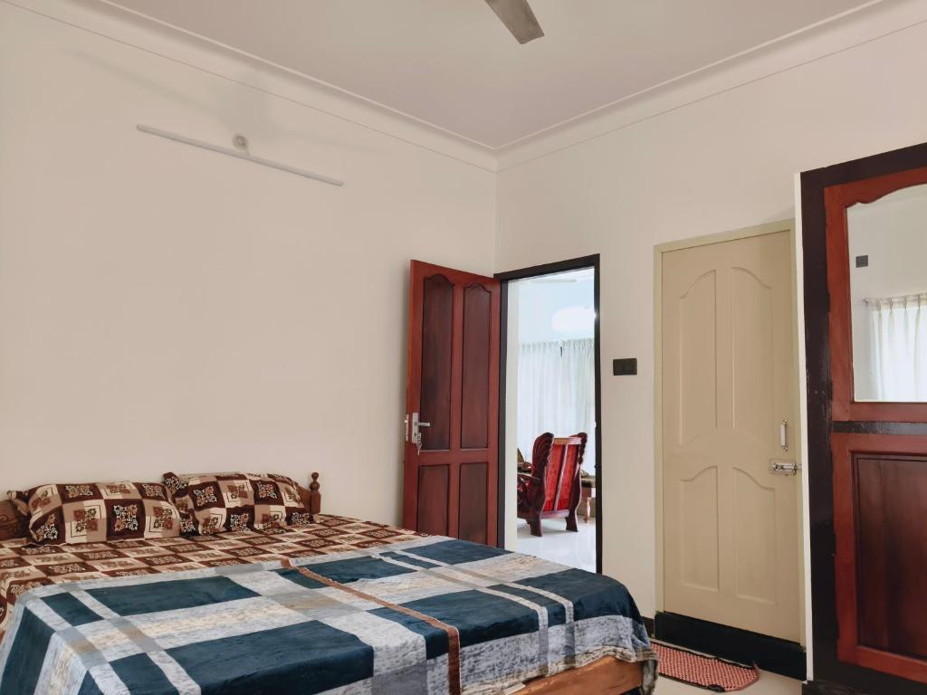 Postel nebo postele na pokoji v ubytování Aromal Homestay