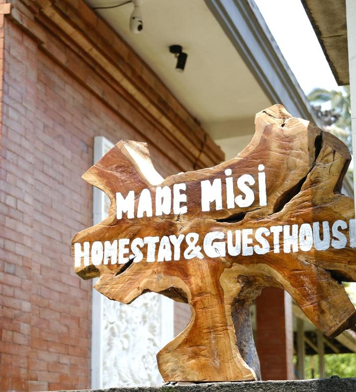 a sign that says make a miss home stay and guesthouse at Made Misi Homestay & Guesthouse in Penginyahan