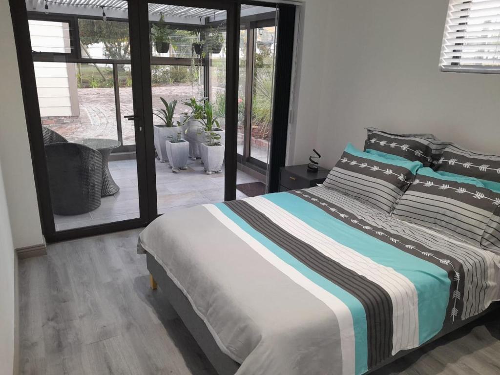 En eller flere senge i et værelse på Suite Serenity