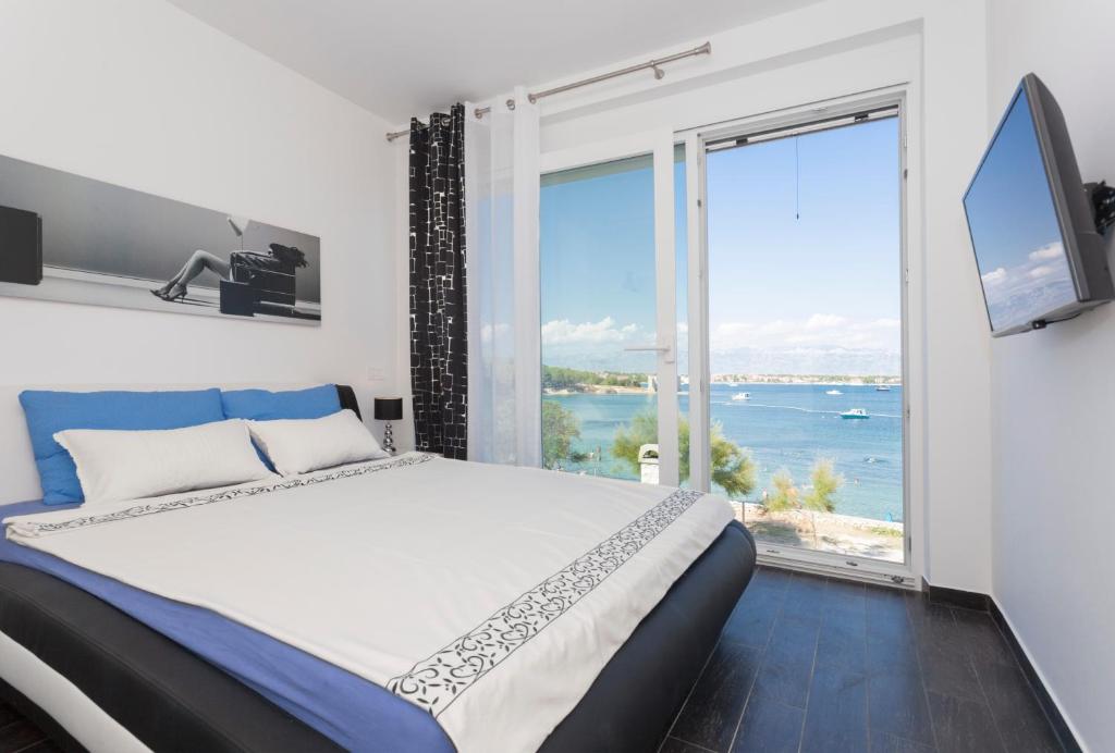 Posteľ alebo postele v izbe v ubytovaní Apartments Svetec