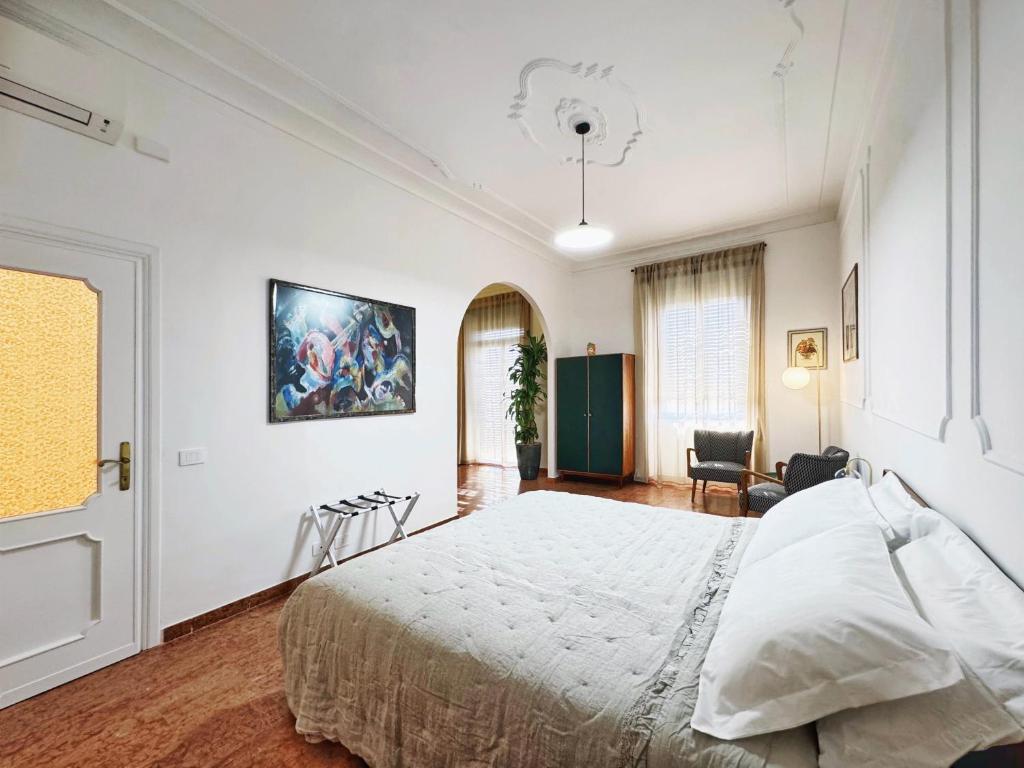 a bedroom with a large bed in a room at Merulana 13 in Rome