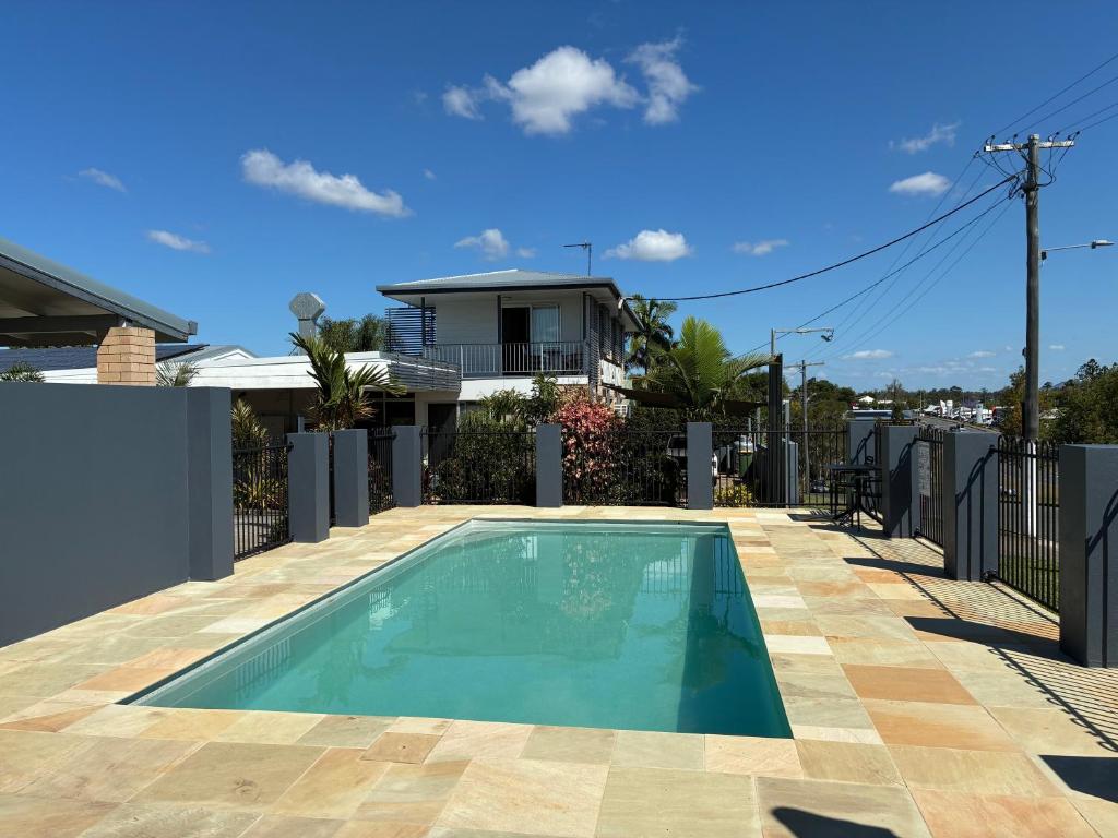 a swimming pool on top of a house at Shady Rest Motel in Gympie