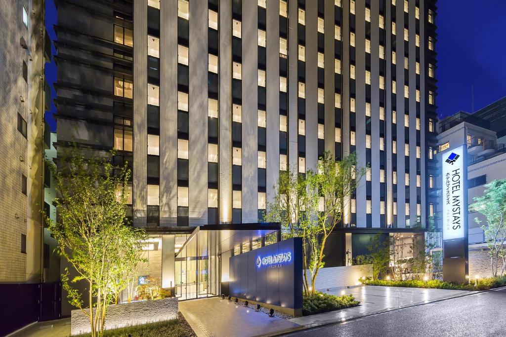 a building with a sign in front of it at Hotel Mystays Premier Akasaka in Tokyo