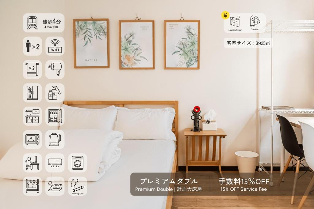 a bedroom with four pictures on the wall and a bed at E JOY INN-Okubo branch in Tokyo