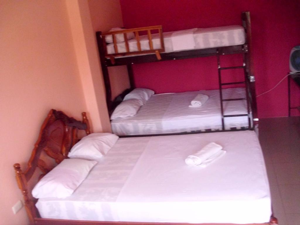 Postel nebo postele na pokoji v ubytování Hostal Alcazaba