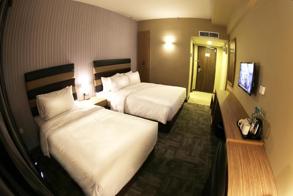 Postel nebo postele na pokoji v ubytování SEM9 Senai "Formerly Known As Perth Hotel"
