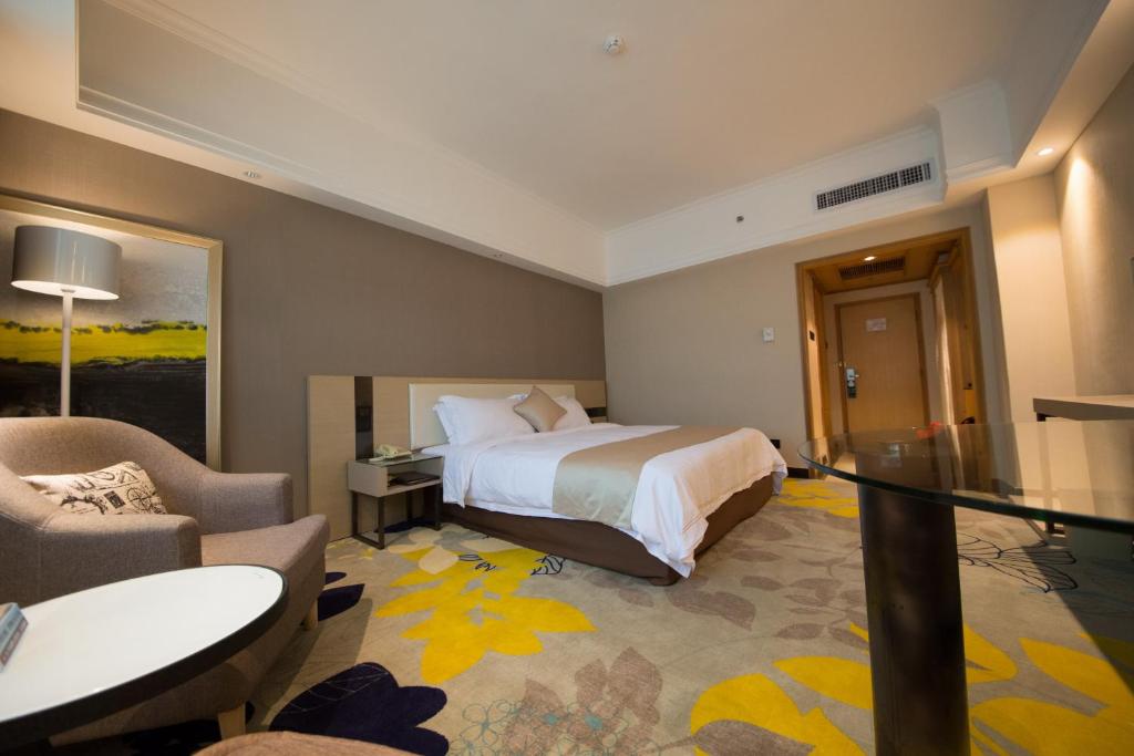 Postel nebo postele na pokoji v ubytování Shenzhen Kaili Hotel, Guomao Shopping Mall