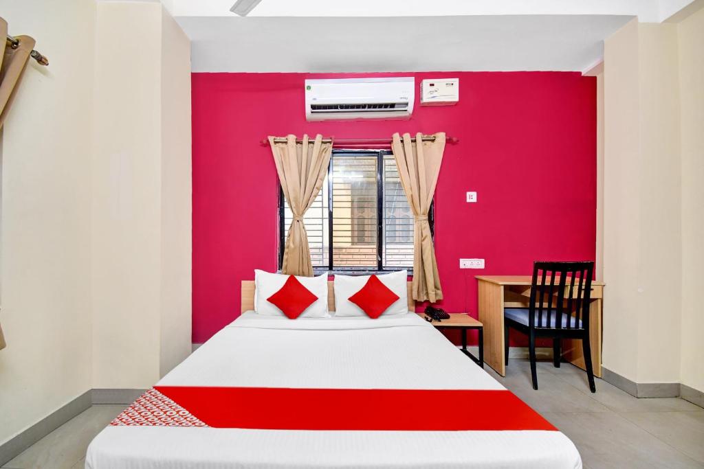 Ένα ή περισσότερα κρεβάτια σε δωμάτιο στο Hotel O Grand Lazeez Dumurjala outdoor Stadium