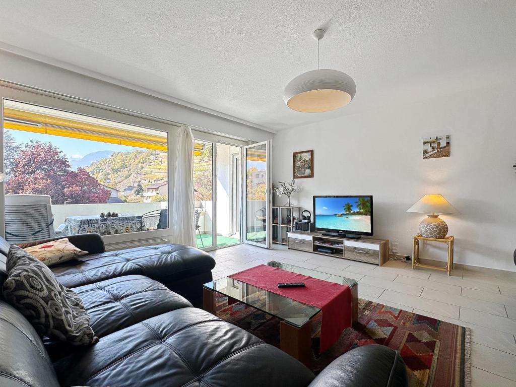 TV a/nebo společenská místnost v ubytování Casa Alps Sion - Swiss Alps