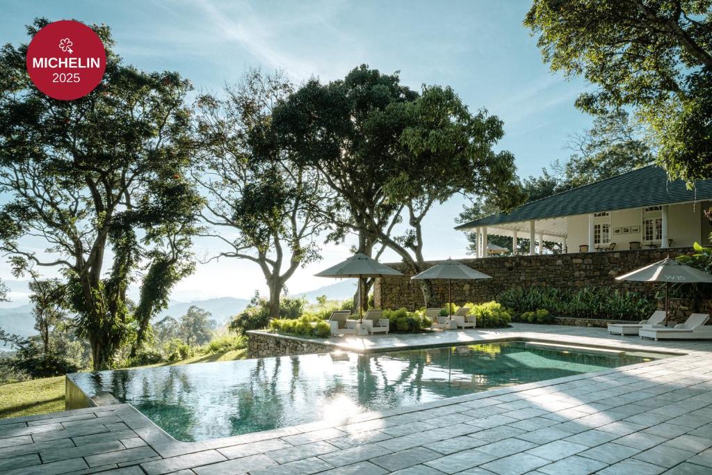 an image of a swimming pool in front of a house at W15 Hanthana Estate Kandy in Kandy