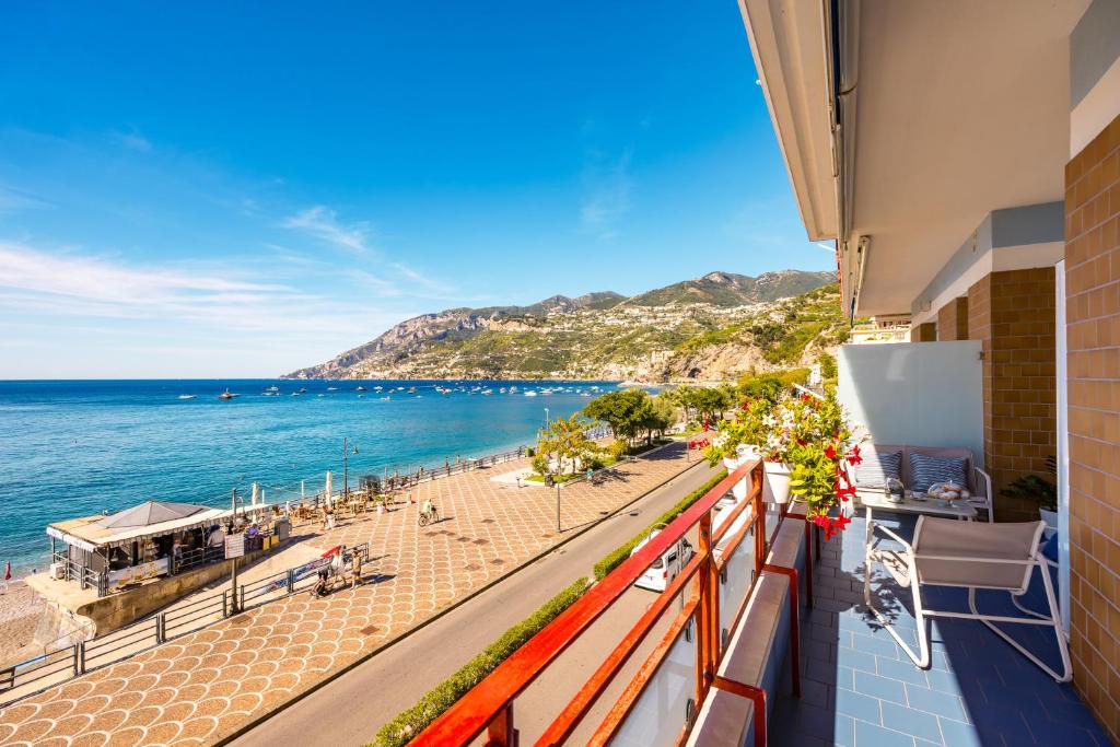 a balcony with a view of the beach at Angelina Apartments Amalfi Coast in Maiori
