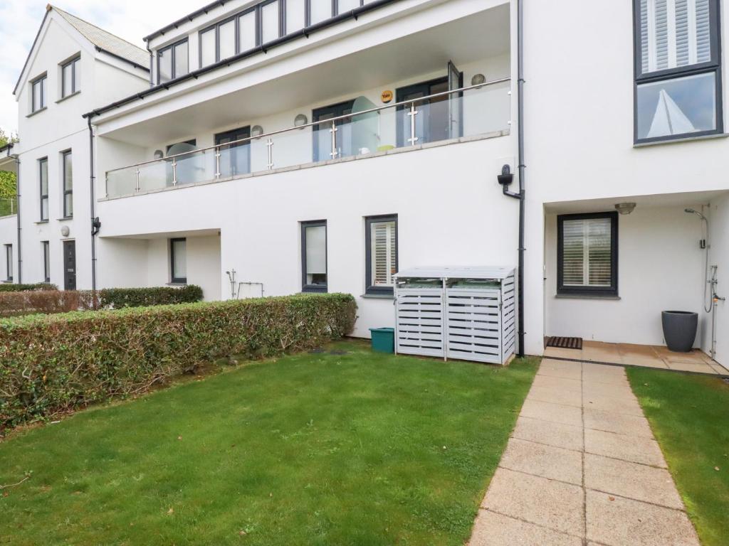 a house with a lawn in front of it at Seaspell Beach House in Padstow