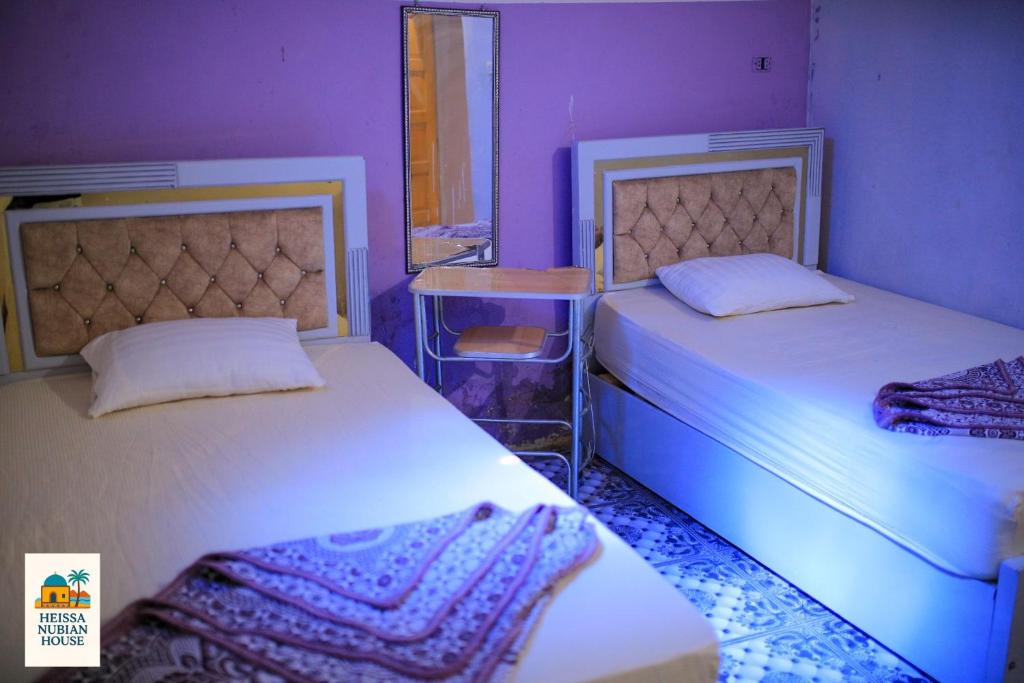 Postel nebo postele na pokoji v ubytování Heissa Nubian Hostel