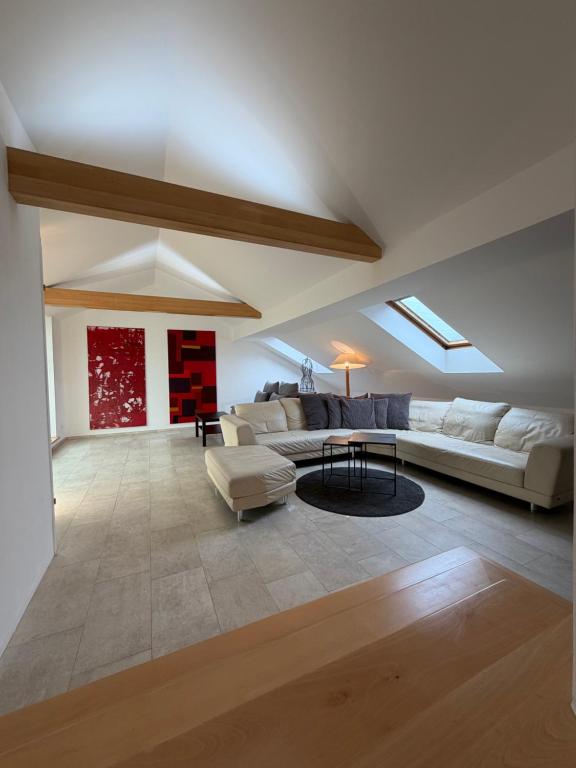 a living room with a couch and a table at undertheroof at in Salzburg