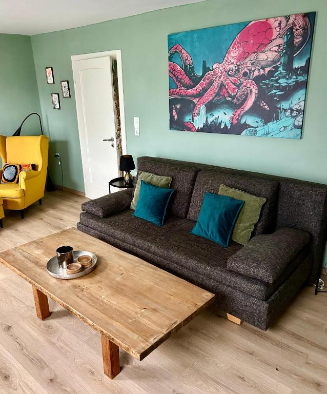 a living room with a couch and a coffee table at Paradiesje 2 in Leer