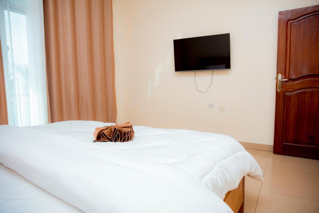 Postel nebo postele na pokoji v ubytování THELIGHT HOTEL KIGALI Rwanda