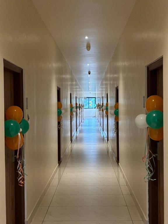 a hallway with balloons on the walls at Triviera Hotel Chirala in Chīrāla