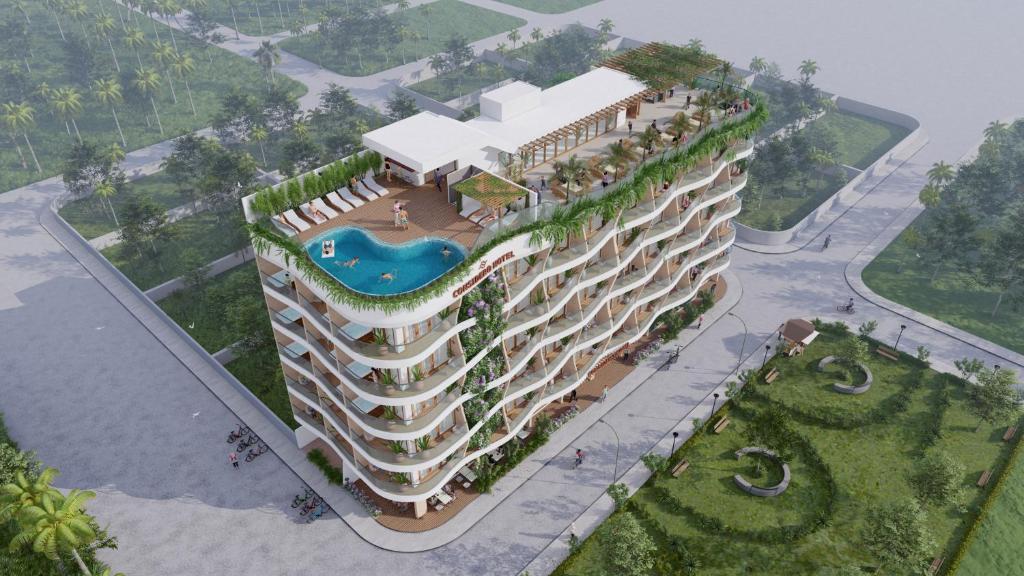einem großen Gebäude mit Pool in der Unterkunft Considero Hotels Maldives - Thoddoo in Thoddoo-Atoll
