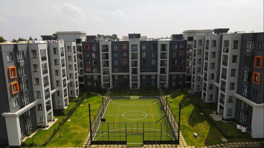 an apartment building with a tennis court in the middle at 2 Bed Inside Tilisi 