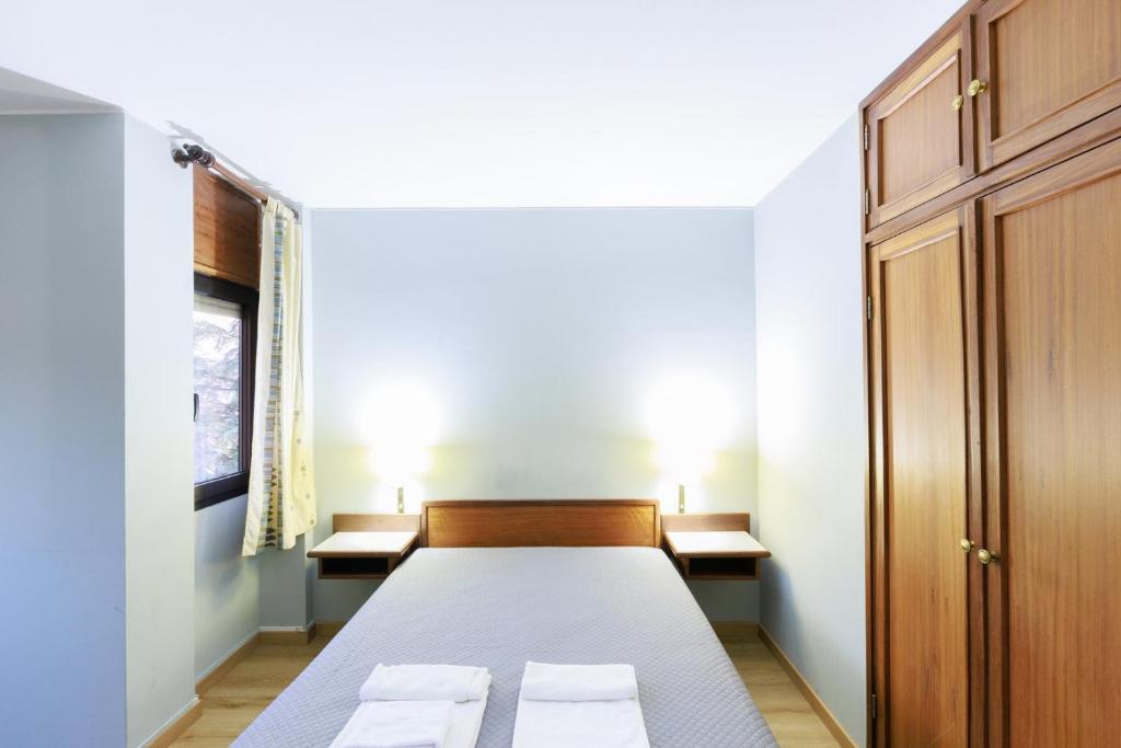 En eller flere senge i et værelse på São Roque Suites