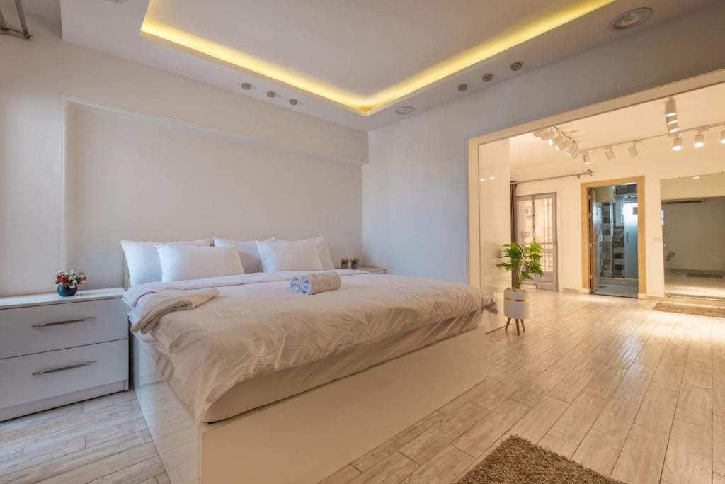 a bedroom with a large bed and a large mirror at luxury house in Cairo