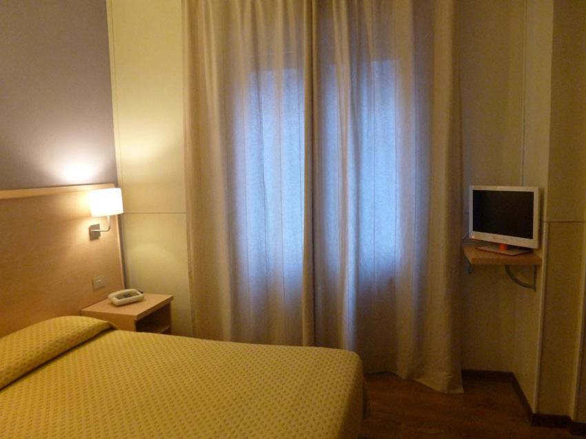 TV a/nebo společenská místnost v ubytování Hotel Da Cesare