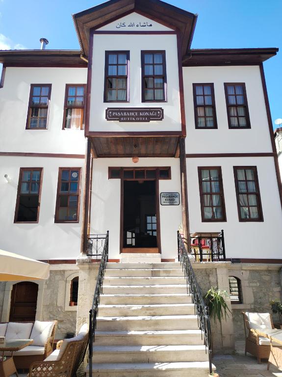 a building with stairs leading up to the door at Paşabahçe Konağı in Unye