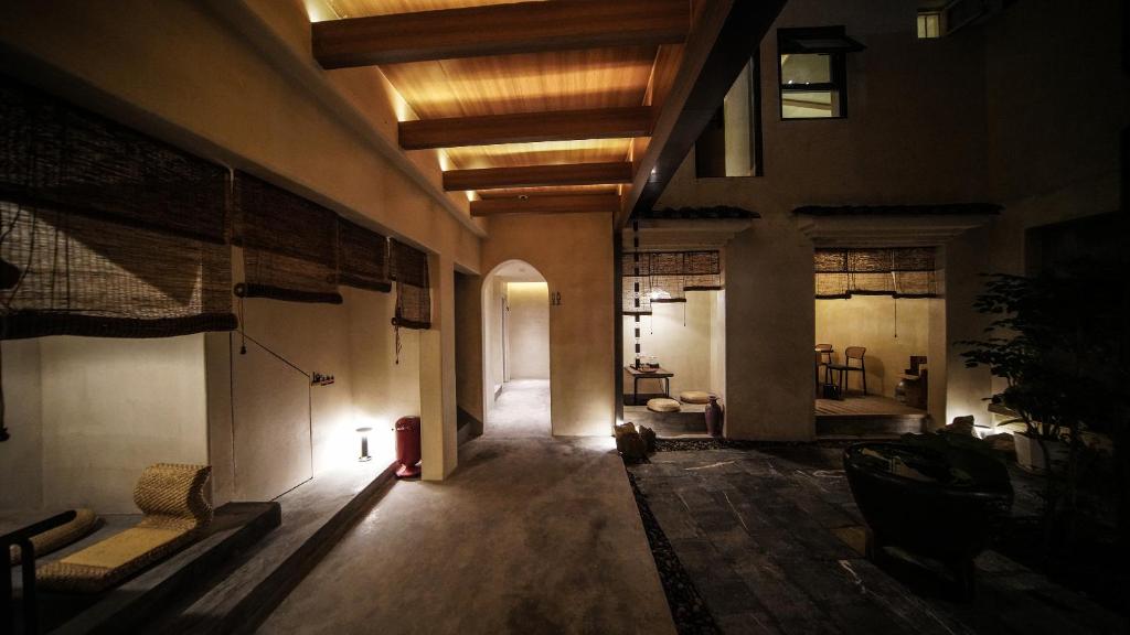 a hallway of an old building with a room at NO.9 Alley Yuchen Res Dence in Guilin