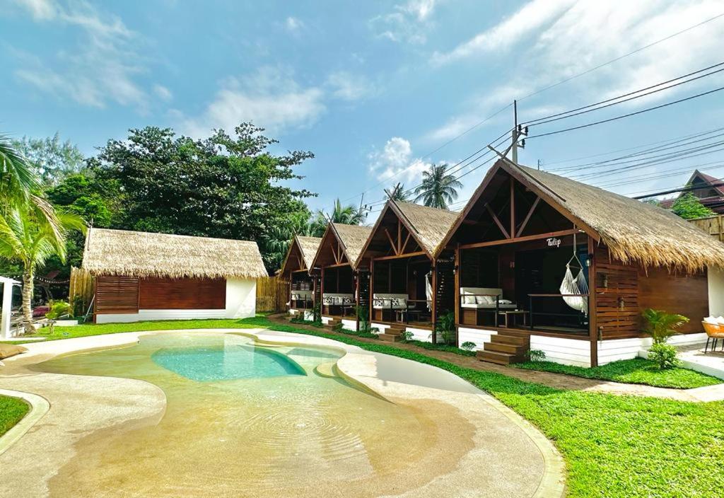 a resort with a swimming pool and a building at Azul Beach Resort and Restaurant in Bophut 