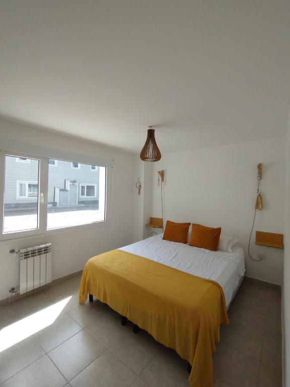 Ένα ή περισσότερα κρεβάτια σε δωμάτιο στο Las Victorias Bariloche