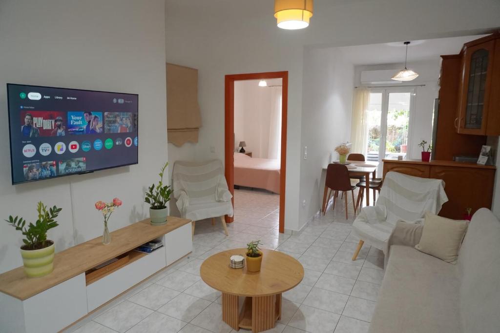 a living room with a couch and a table at Ionian Nest in Argostoli
