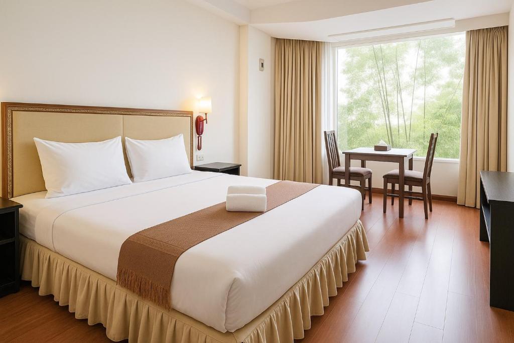 Postel nebo postele na pokoji v ubytování The Grand Imperial