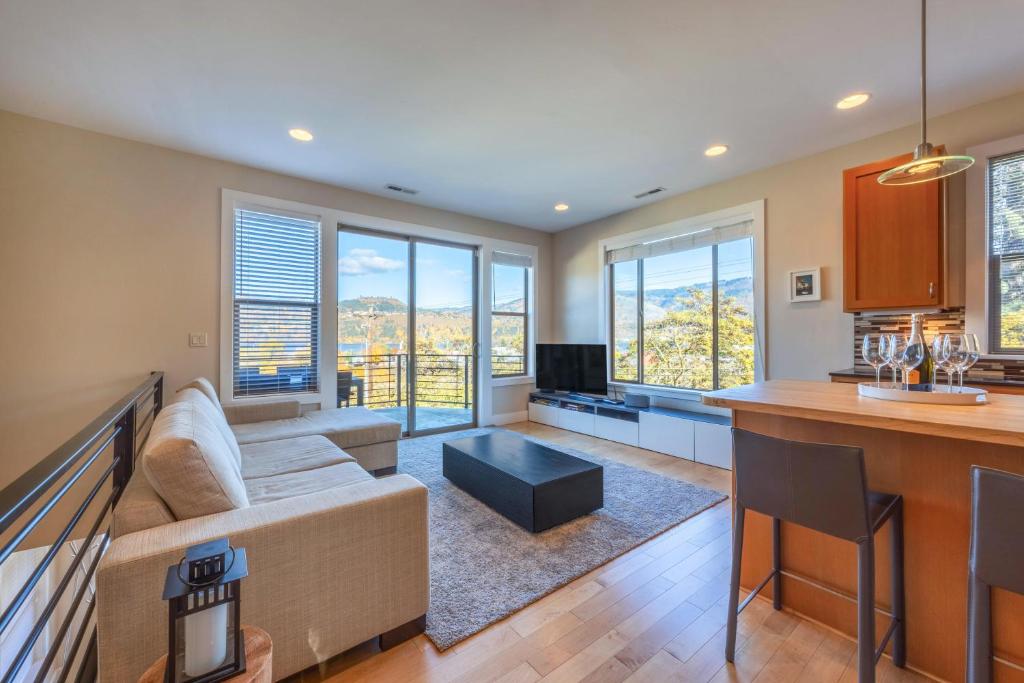 a kitchen and living room with a couch and a table at Bluff View 30 Day in Hood River